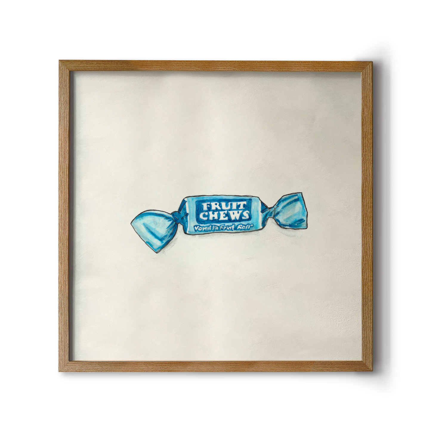 A framed artwork of blue fruit chew candy with the brand name visible, presented against a white background.