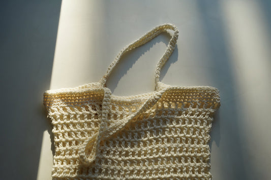 Handmade crochet bag on a white background