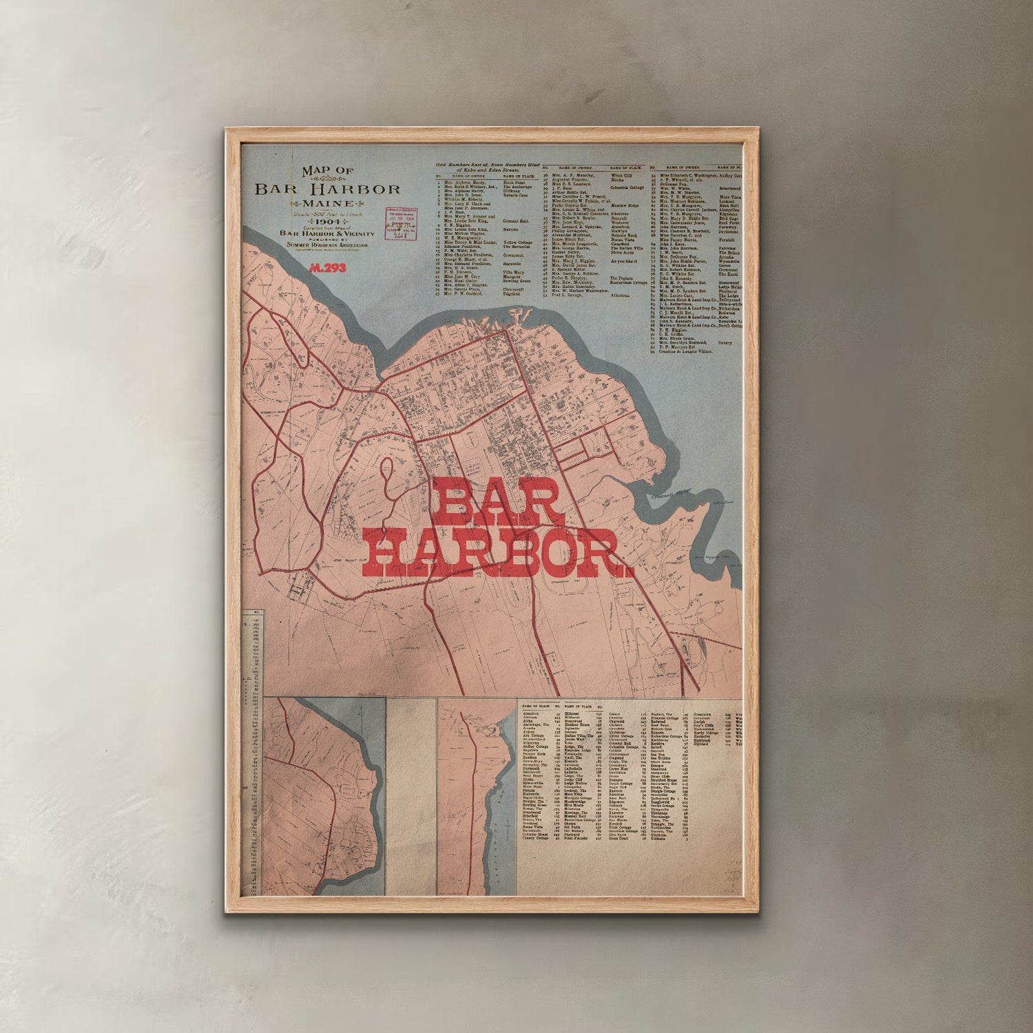Framed map of Bar Harbor with red text on a gray wall