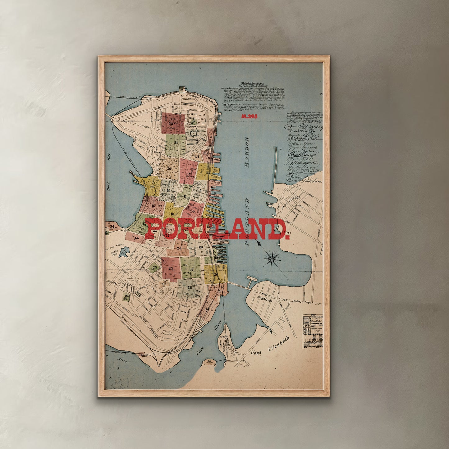 Framed map of Portland on a wall