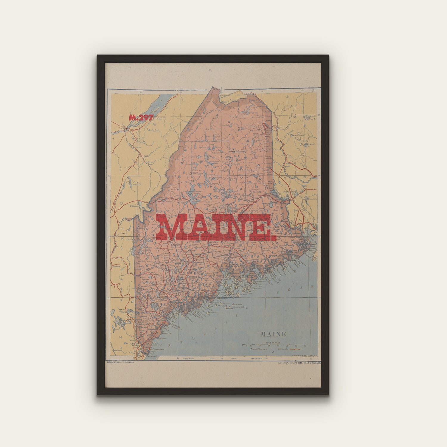 Framed map of Maine with a red 'MAINE' text on a light background