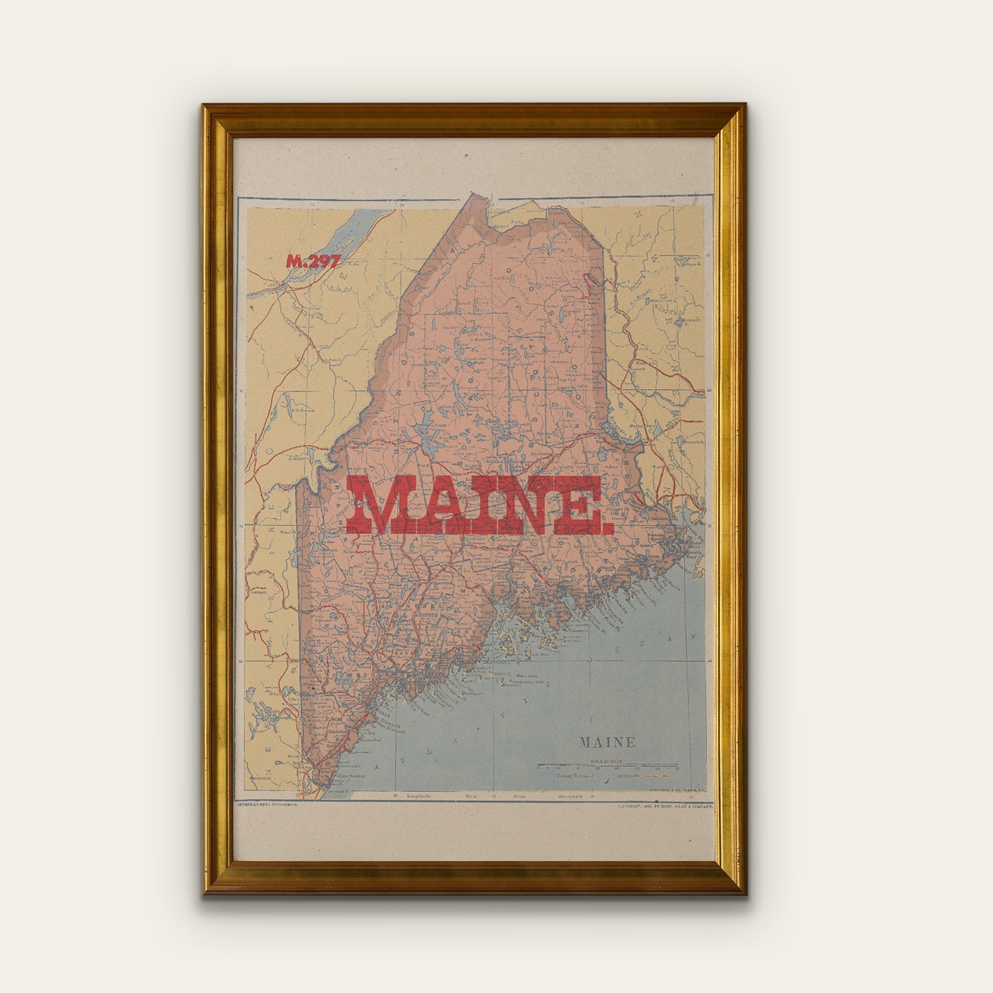 Framed map of Maine on a white wall