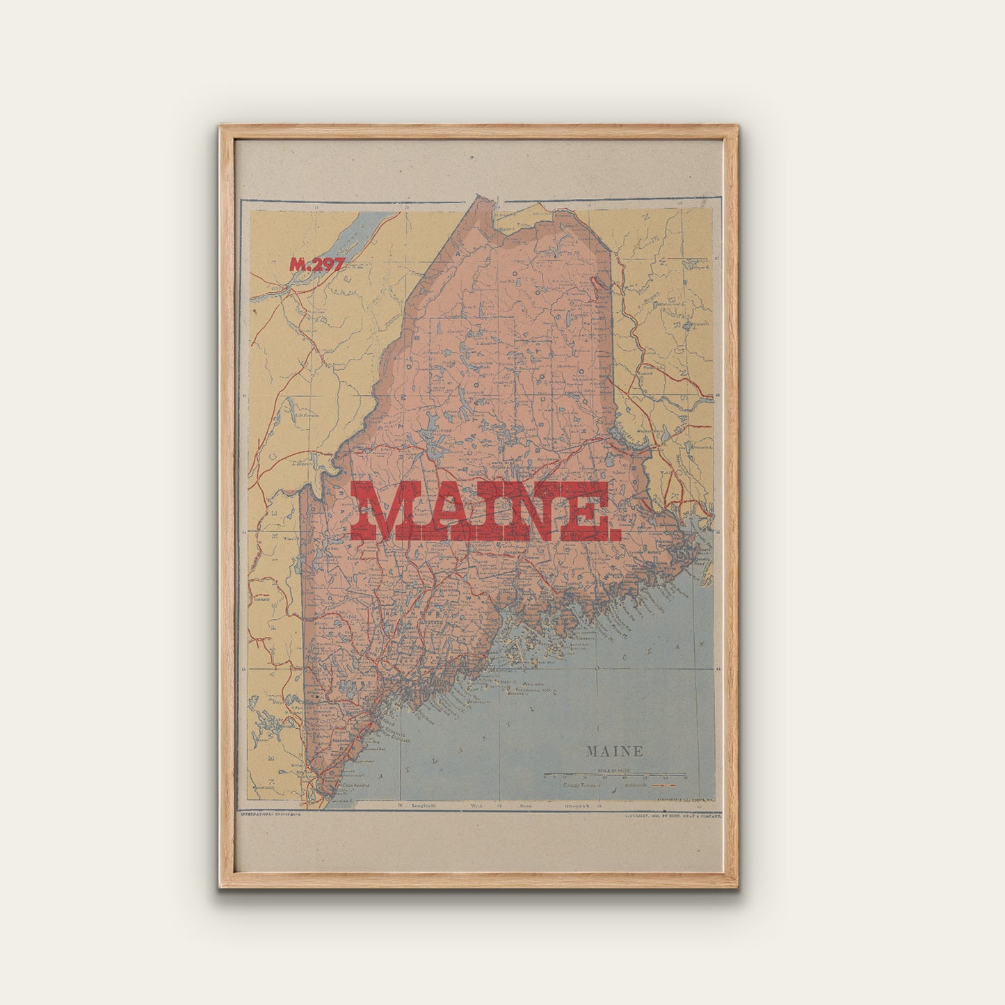 Framed map of Maine with 'MAINE' printed in red on a light background