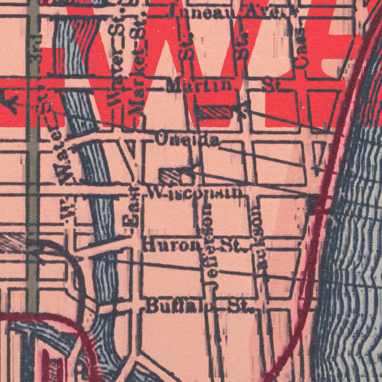 Close-up of a vintage-style street map with red and black text on a beige background.