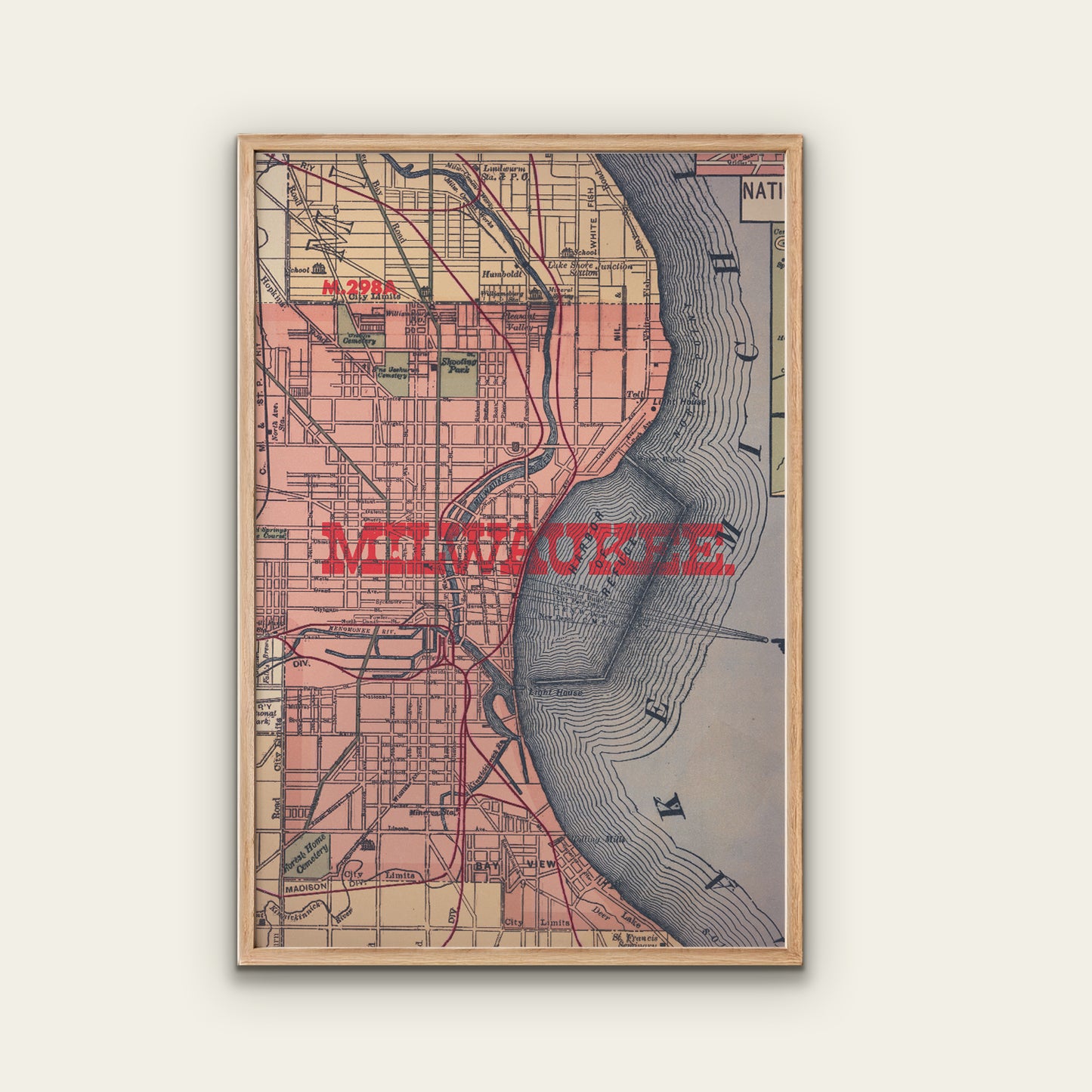 Framed vintage-style map of Milwaukee on a white wall
