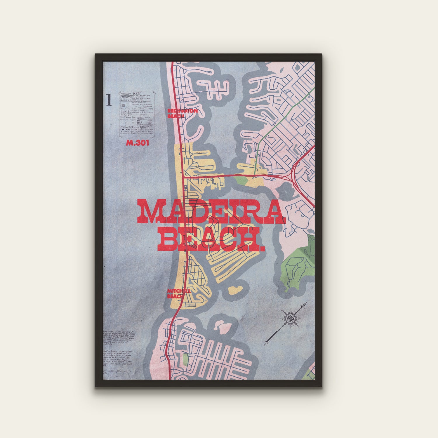 Framed map poster of Madeira Beach with colorful design on a white wall.