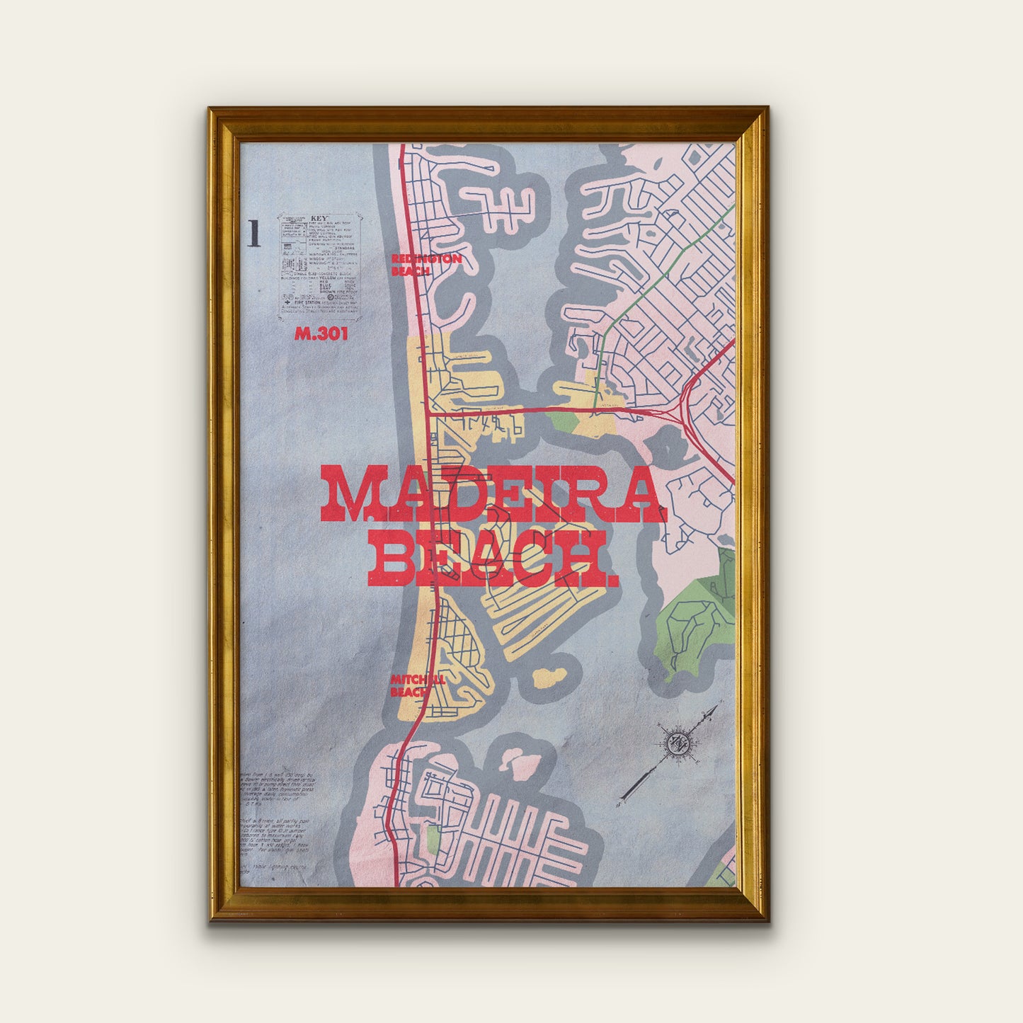 Framed map poster of Madeira Beach with a gold frame on a white wall.