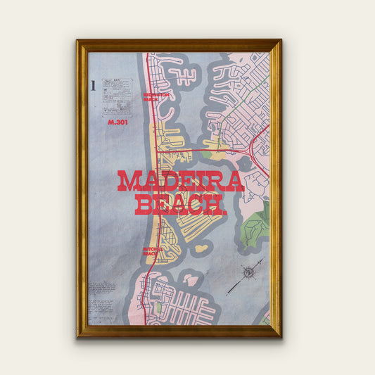 Framed map poster of Madeira Beach with a gold frame on a white wall.