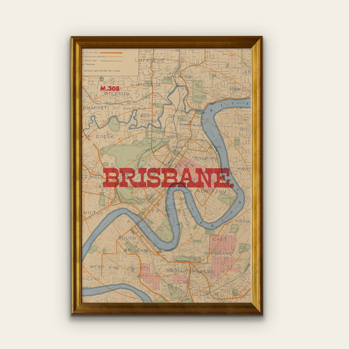 Framed vintage-style Brisbane city map wall art with a gold frame, shown hanging against a light neutral wall. The map features a beige background, blue river lines, and large red 'BRISBANE' text across the center.