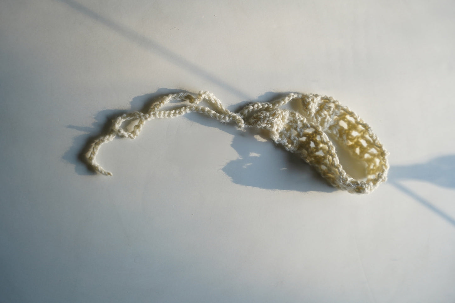 Crocheted headband on a light background