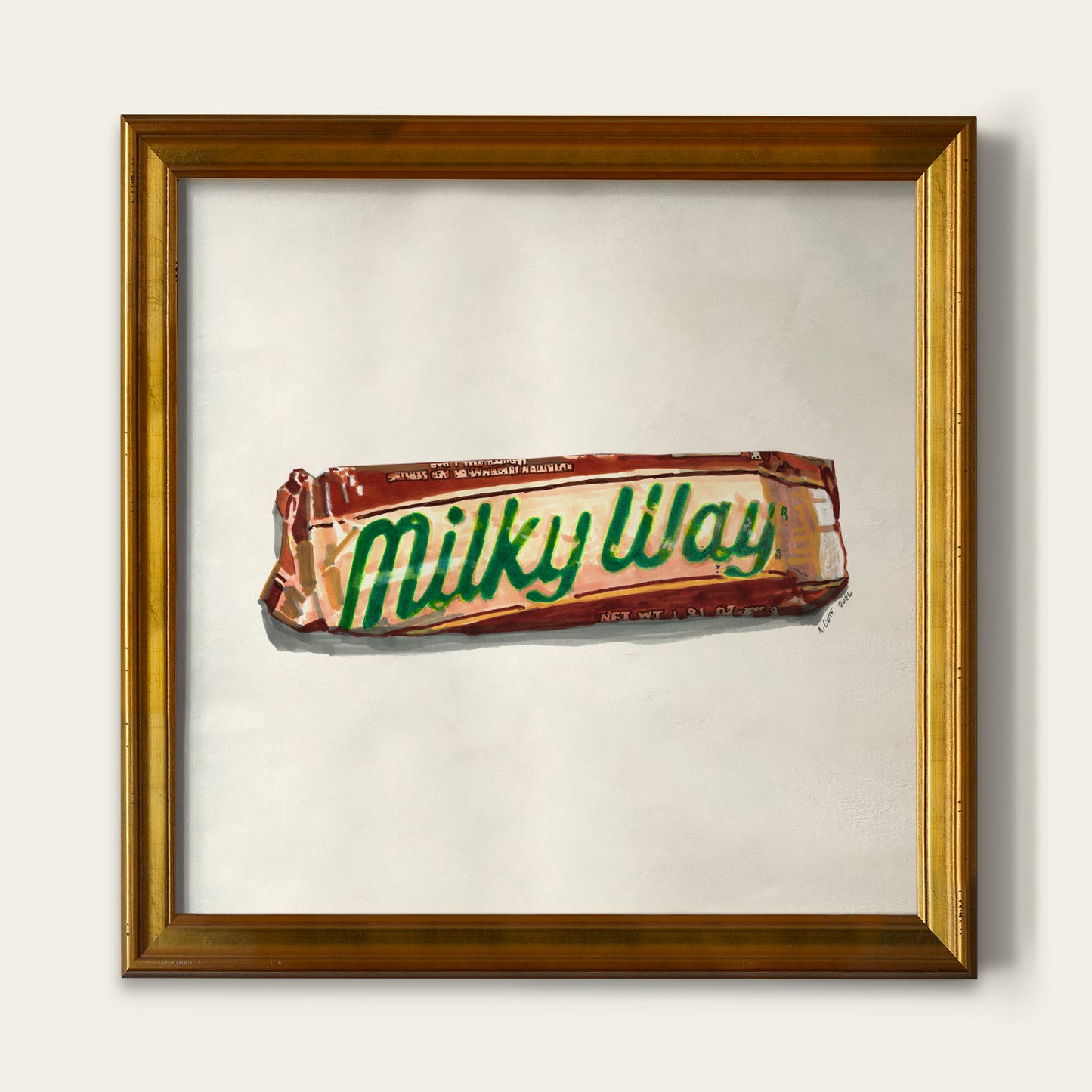 A framed art print depicting a stylized painting of a Milky Way candy bar on a light background, enclosed in a gold-toned wooden frame.