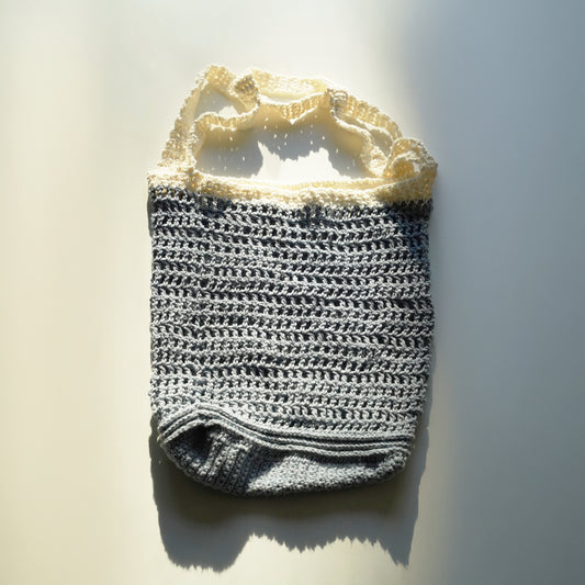 Crochet bag with a textured pattern on a light background