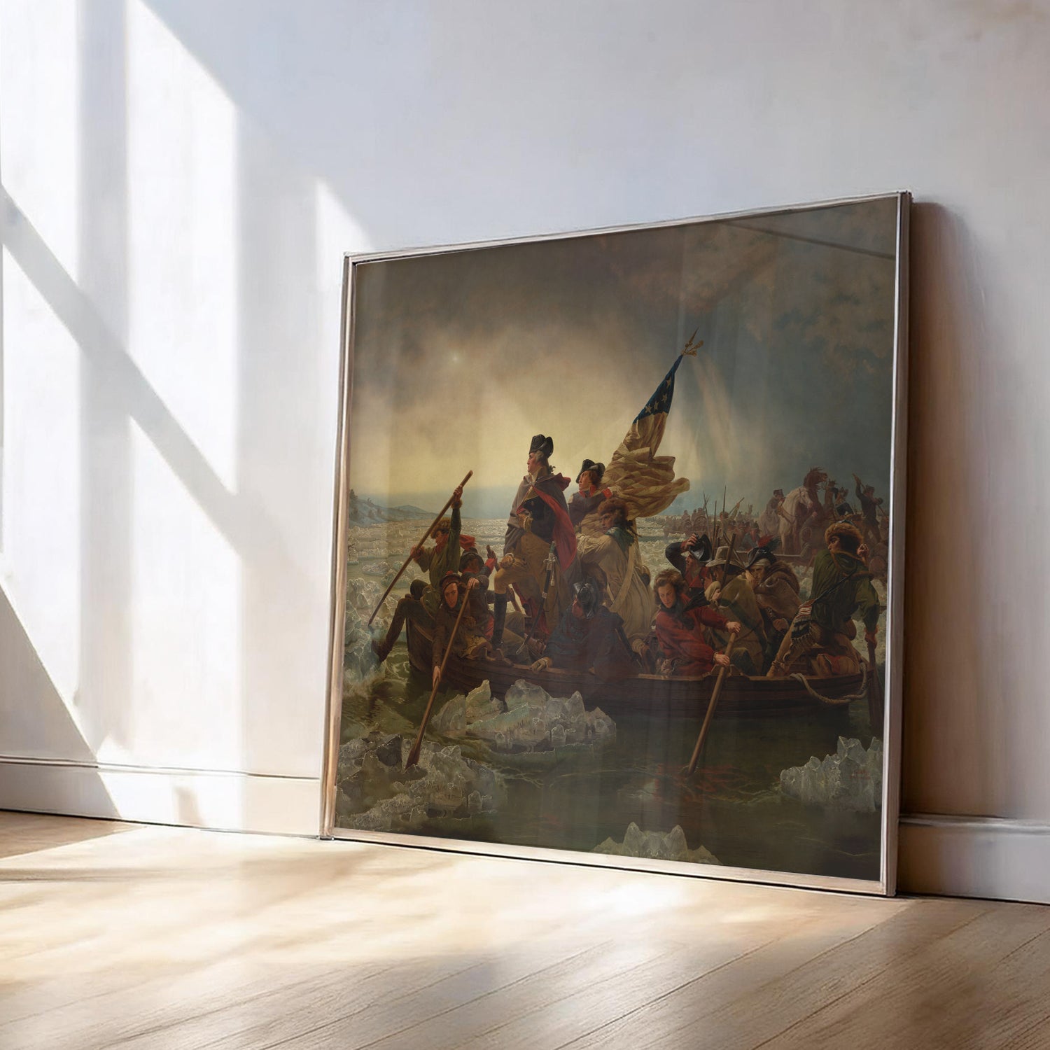 Framed painting of a historical scene on a wall with sunlight casting shadows.