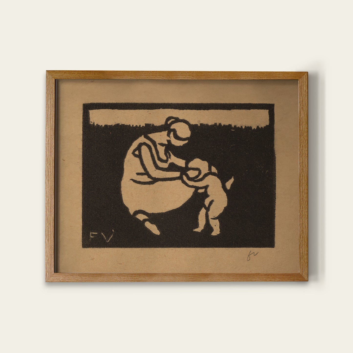 Framed artwork of a mother and child silhouette on brown paper.