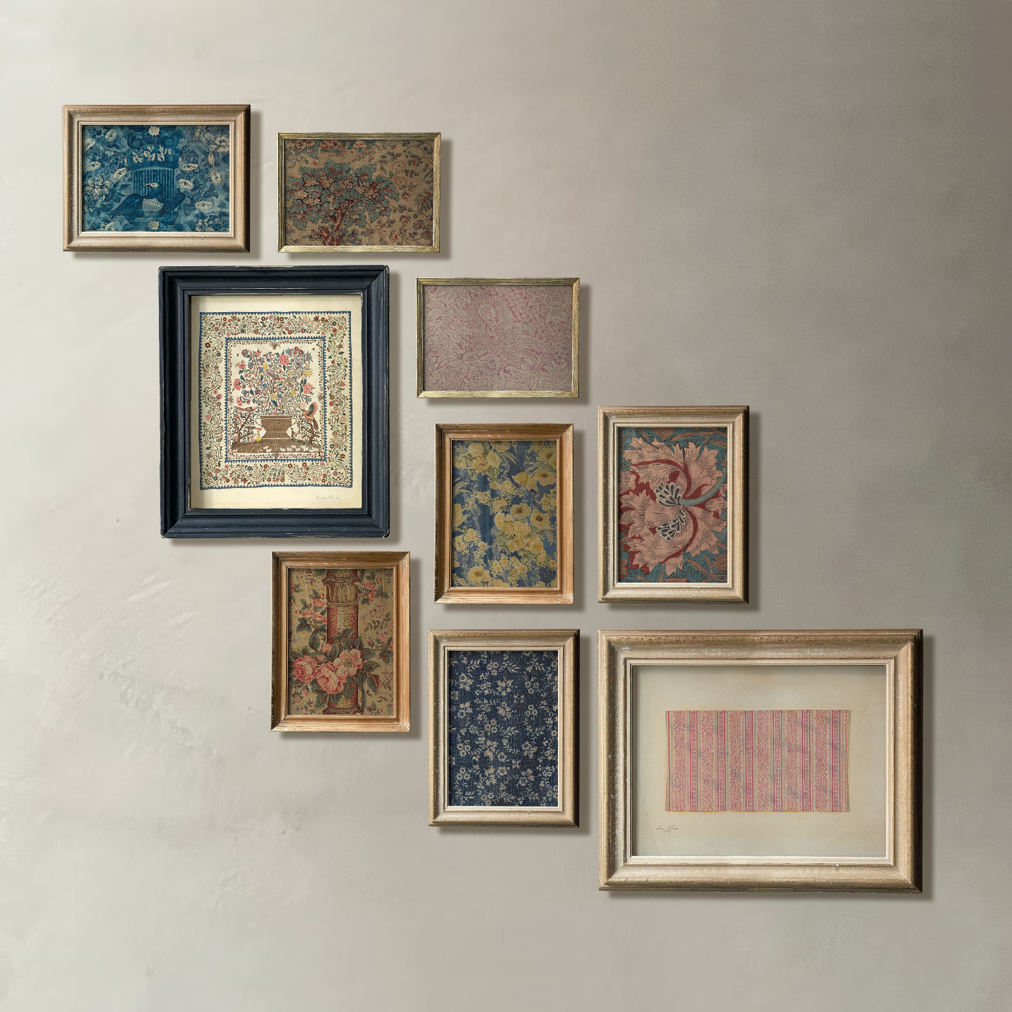 Collection of framed textile designs on a wall
