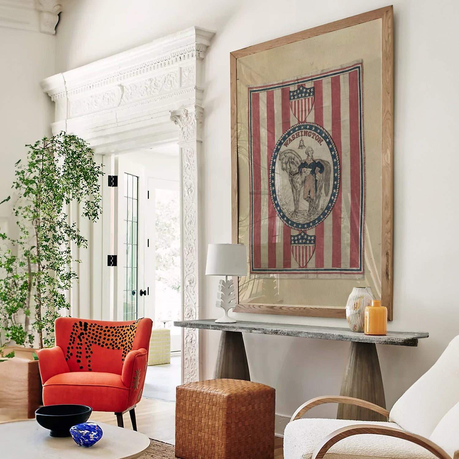 Living room with red armchair, framed artwork, and decorative items.