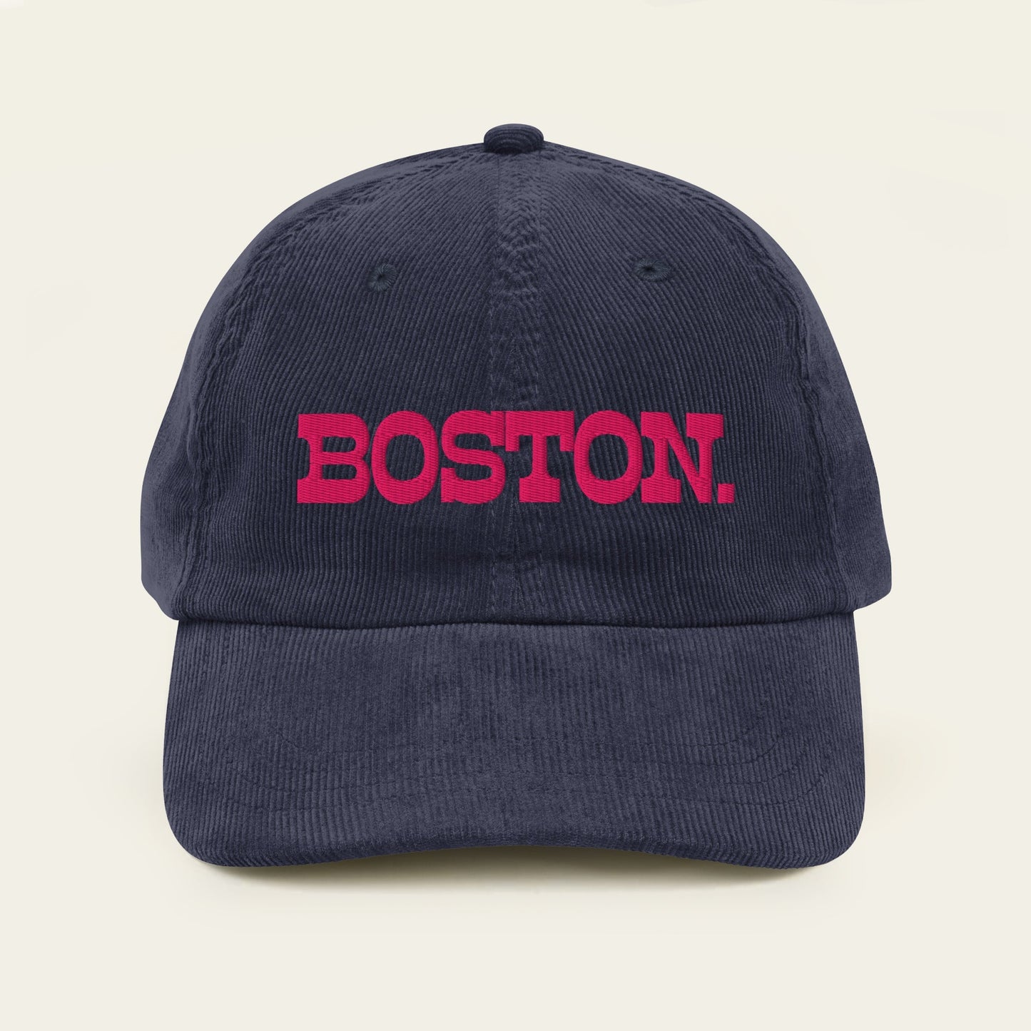 Navy blue cap with 'BOSTON.' in red on a beige background